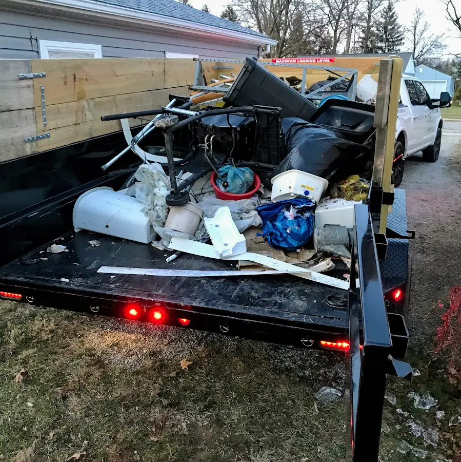 Roll-off dumpster delivered to a residential driveway in Watertown